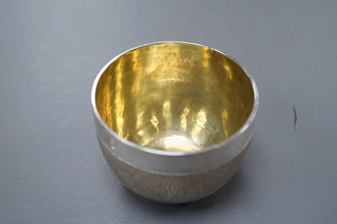 An Elizabeth II textured silver tumbler cup, possibly by Keith Tyssen, London, 1975, with later engraved inscription, height 50mm, 136 grams.